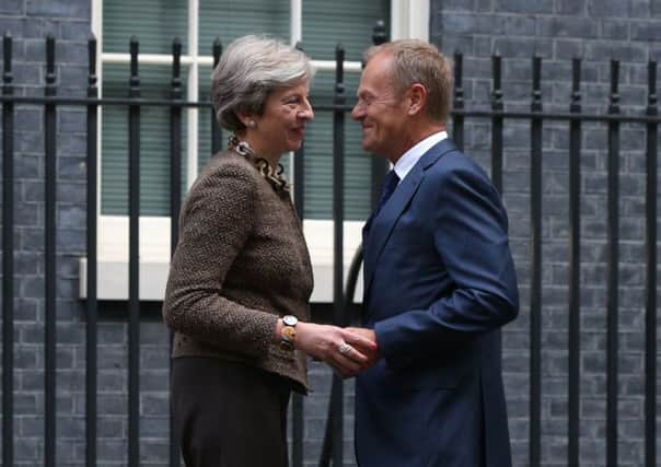 Prime Minister Theresa May greets President of the European Council Donald Tusk at 10 Downing Street.