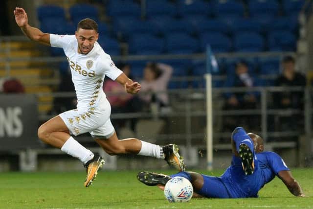 Kemar Roofe evades a challenge from former Leeds favourite, Sol Bamba. Picture: Bruce Rollinson.