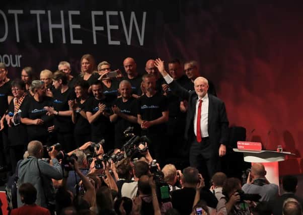 Labour leader Jeremy Corbyn om stage at party conference