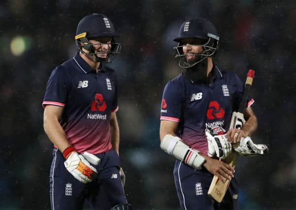 WINNING TEAM: England's Jos Buttler and Moeen Ali (right) are all smiles. Picture: John Walton/PA