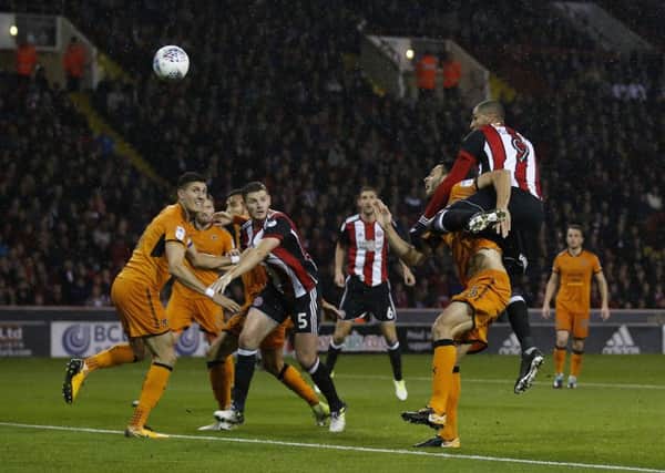 Leon Clarke rises highest to score his and Sheffield United's second goal sagainst Wolves on Wednesday night. Picture: Simon Bellis/Sportimage