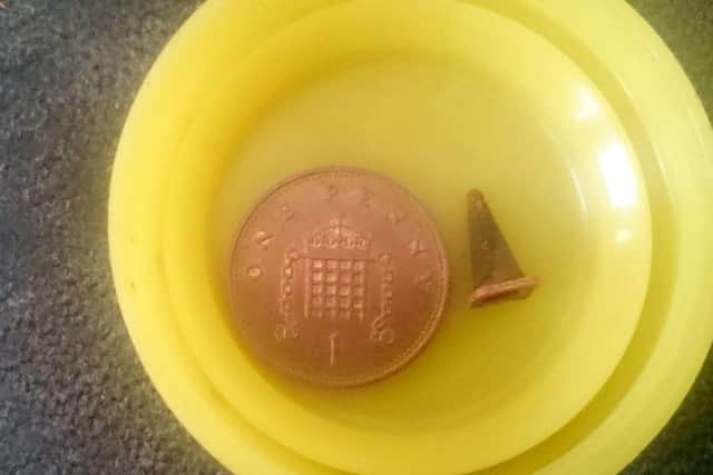 The traffic cone which was in his lung, next to a 1p coin (for scale)