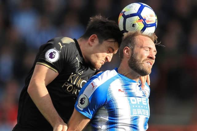 Leicester City's Harry Maguire (left) and Huddersfield Town's Laurent Depoitre battle for the ball during the Premier League match at the John Smith's Stadium, Huddersfield. (Picture: PA)