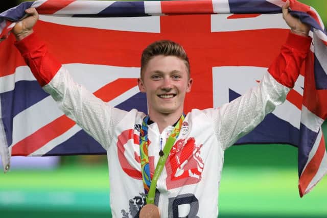 Great Britain's Nile Wilson celebrates winning a bronze medal in the men's high bar (Picture: Owen Humphreys/PA Wire)
