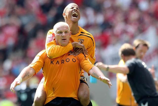 Fraizer Campbell jumps on Hull City team-mate Dean Windass after he scores what proved to be the winning goal at Wembley back in 2008. Picture: Nick Potts/PA