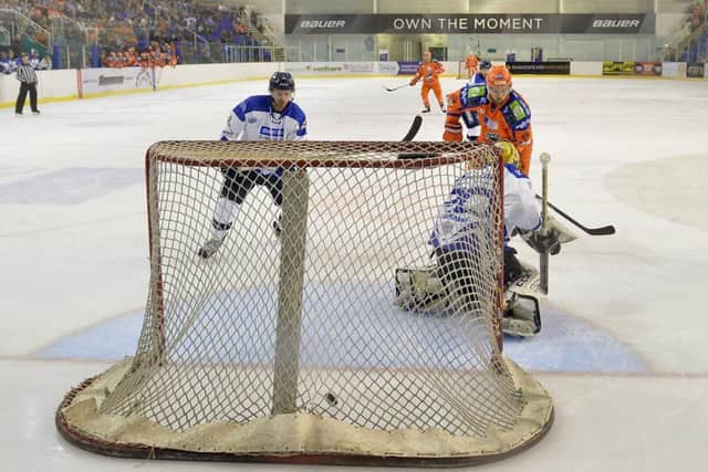 UP AND RUNNING: Matt Marquardt grabs his first Steelers' goal against Milton Keynes on Wednesday night. Picture: Dean Woolley.