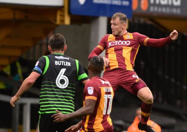Take that: Charlie Wyke heads in Bradford's opener against Doncaster Rovers. 
Picture: Bruce Rollinson