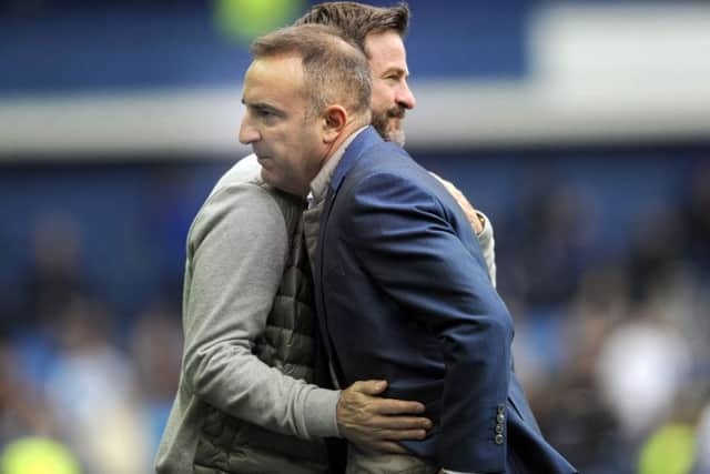 Rival bosses Carlos Carvalhal and Thomas Christiansen exchange pleasantries after the Hillsborough encounter. Picture: Steve Ellis