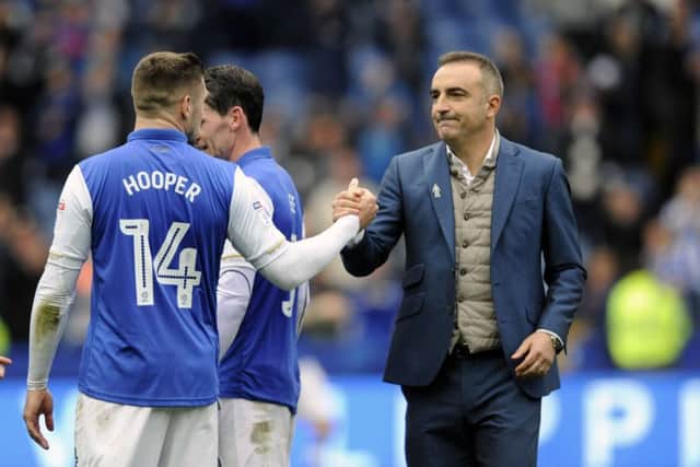 WELL DONE: Sheffield Wednesday boss Carlos Carvalhal congratulates goalscorers Kieran Lee and Gary Hooper after their side's 3-0 victory over Leeds United. Picture: Steve Ellis
