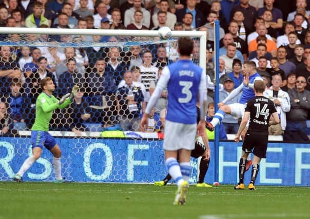 Gary Hooper rises to head his and Sheffield Wednesday's second goal in their 3-0 win over Leeds United (Picture: Tony Johnson).