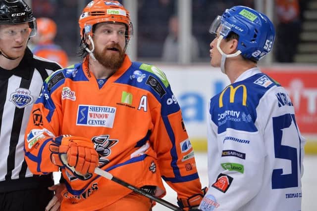 Sheffield Steelers defenceman Zack Fitzgerald, left, exchanges a few pleasantries with Coventry Blaze forward Kevin Noble.

Picture: Dean Woolley