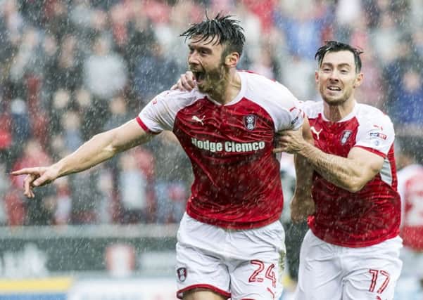 Rotherham United loanee Keiffer Moore celebrates with Richie Towell after scoring against Northampton, one of nine goals the Ipswich man has netted so far this season.