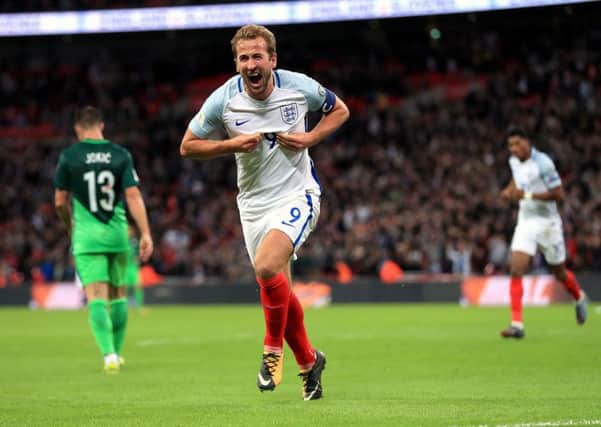 Captain Harry Kane is jubilant as he celebrates after scoring the late goal that beat Slovenia and earned England a place in the 2018 World Cup finals (Picture: Adam Davy/PA).