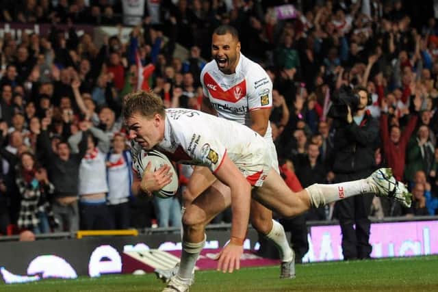 Michael Shenton goes over to score a try for St Helens during the Engage Super League Grand Final at Old Trafford, Manchester., in 2011 (Picture: Anna Gowthorpe/ PA Wire)