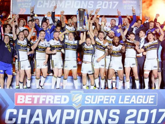 Leeds Rhinos receive the Super League trophy