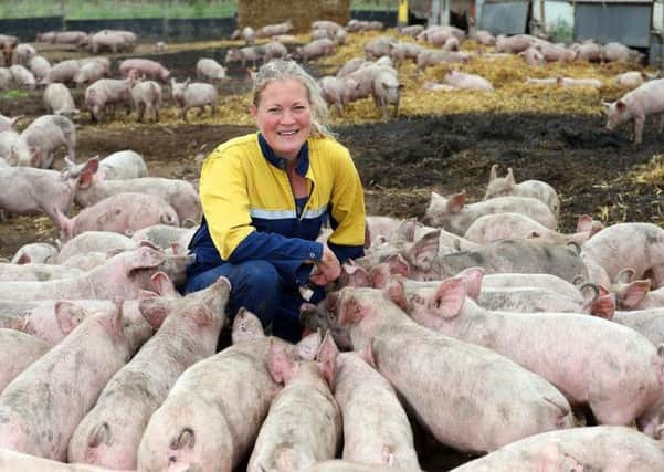 Anna Longthorp with her pigs which she rears near Doncaster. She is one of two Yorkshire farmers featured in the new 'Countryside Kitchen: Farm, Food, Fork' cook book.