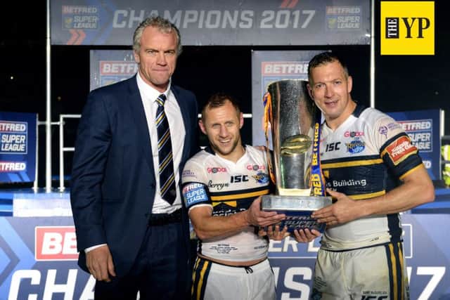 ALL SMILES: Leeds Rhinos' head coach Brian McDermott celebrates with Rob Burrow and Danny McGuire.  Picture: Bruce Rollinson