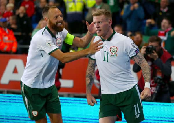 Hull City's David Meyler, left, captained the Republic of Ireland against Wales in Cardiff on Momnday and celebrates the winning goal with James McClean. Picture: Nigel French/PA