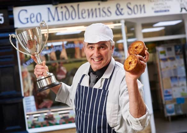Peter Middlemiss with award winning pork pies and trophy. Photo: John Houlihan