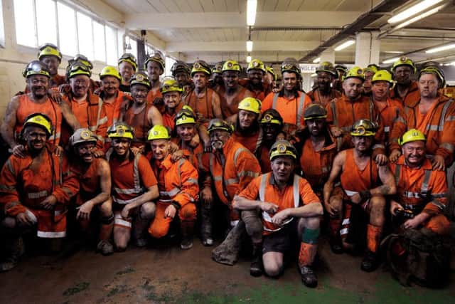 The last shift: Miners in the lamp room after thier last shift, as deep coal mining comes to an end in the UK at Kellingley Colliery in 2015