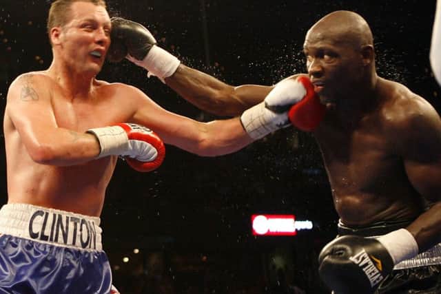 Clinton Woods, left, of England, and Antonio Tarver, right, exchange jabs during the tenth round of the IBF/IBO light heavyweight championship boxing match on Saturday, April 12, 2008, in Tampa, Fla. Tarver won a unanimous decision. (AP Photo/Mike Carlson)