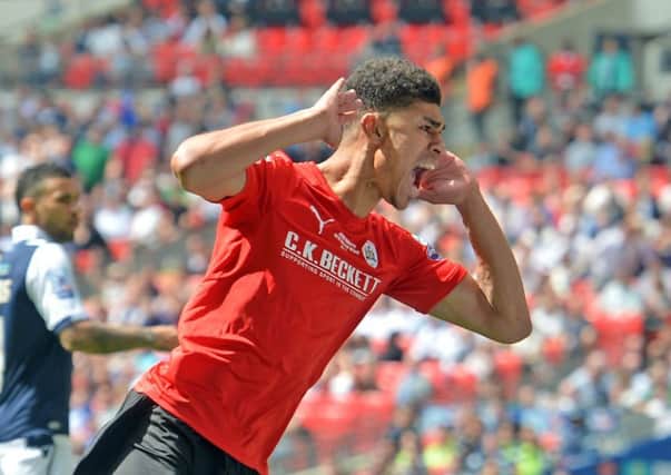 STAR TURN: Ashley Fletcher celebrates his goal for Barnsley at Wembley back in May 2016.  Picture: Tony Johnson