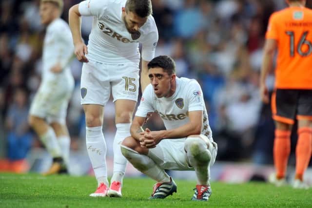 Stuart Dallas has a word with Pablo Hernandez after missing a late penalty. Picture Tony Johnson.
