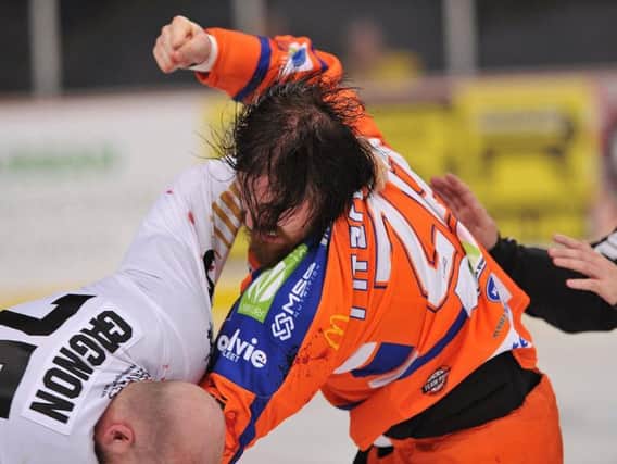 Zack Fitzgerald fights with Nottingham Panthers' Mathieu Gagnon on Saturday night. Picture: Dean Woolley.