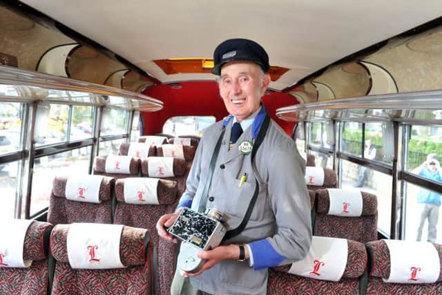 Former Ledgard conductor Chris Youhill aboard a vintage Samuel Ledgard bus in Otley.