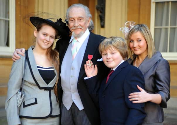 Roy Dotrice with his grandchildren (from left) Phobe Lumley, 14, Oscar Lumley, 12 and Emily Woodward, 24 after collecting his OBE