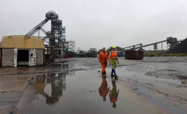 Miners Paul Mountjoy and Roy Cullier walk inside the closed Hatfield Colliery. Picture: Anna Gowthorpe