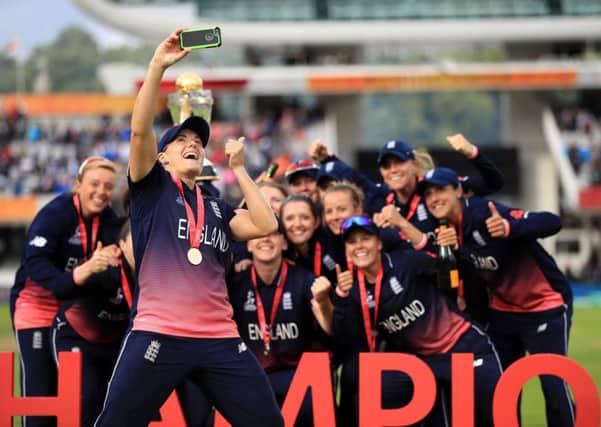England's Katherine Brunt takes a selfie with the England women's team as they celebrate with the trophy during the ICC Women's World Cup Final at Lord's, London. (Picture: John Walton/PA Wire)