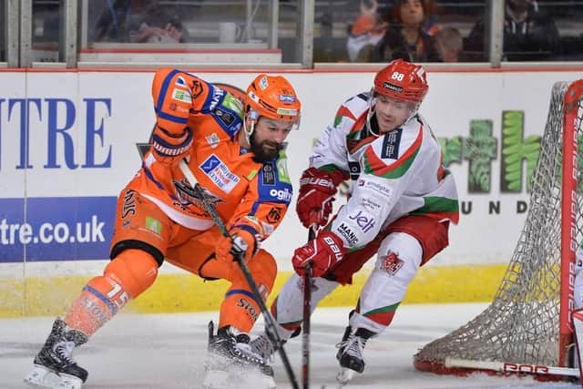 Mathieu Roy battles for possession around the Cardiff Devils' goal in Saturday night's 4-0 win over the defending Elite League champions. Picture: Dean Woolley.