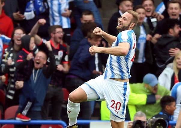 Get in: Huddersfield Town's Laurent Depoitre celebrates scoring his side's second goal of the game.