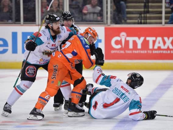 Colton Fretter tangles with Spiro Goulakos in the third period - both were ejected from the game shortly after. Picture: Dean Woolley.