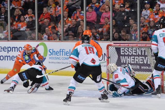 SNAPSHOT: John Armstrong, far left, fires home Sheffield Steelers' second goal of the night. Picture: Dean Woolley.