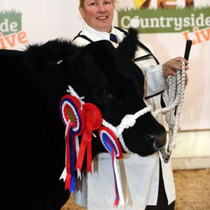 Melanie Alford with her supreme beef champion. Picture by Jonathan Gawthorpe.