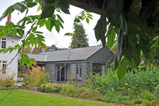 The garage/garden studio. Zinc cladding from York-based Varla was commissioned for the canopy, the roof  and to partly cover the blockwork walls.
