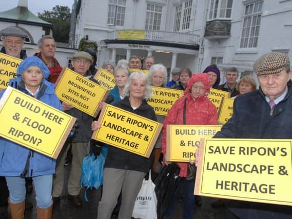 Ripon city councillor Peter Horton with protesters outside Ripon Spa Hotel at the start of the public inquiry. Picture: Adrian Murray.