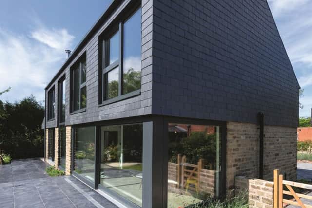The rear of the property is two-storeys and heavily glazed to utilise solar gain and make the most of the garden views.