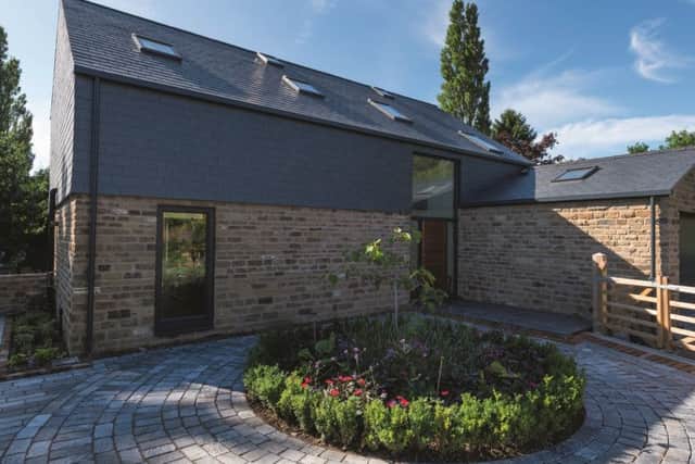 The rear of the property is one-and-a-half storeys, which satisfied  planners and ensured that it doesn't overlook the other house on the site.