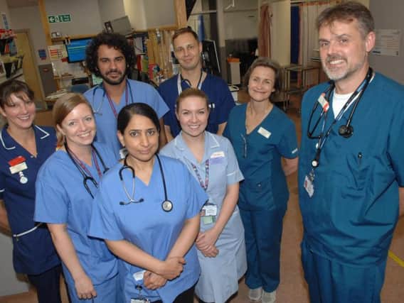Clinical Lead and Consultant in Emergency Medicine Dr. Matt Shepherd with some of the members of the A&E team, Sister Kirstie Fitt, Dr. Jennifer Lockwood, Dr. Nas Malik, Dr. Kanwal Uzair, Registered Nurse Katie Stockdale, Clinical Practitioner Darran Miller and Dr. Helen Law. (1710245AM1)