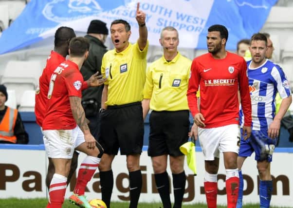 Off:  Barnsley's Emmanuel Frimpong is sent off by referee Andre Marriner.