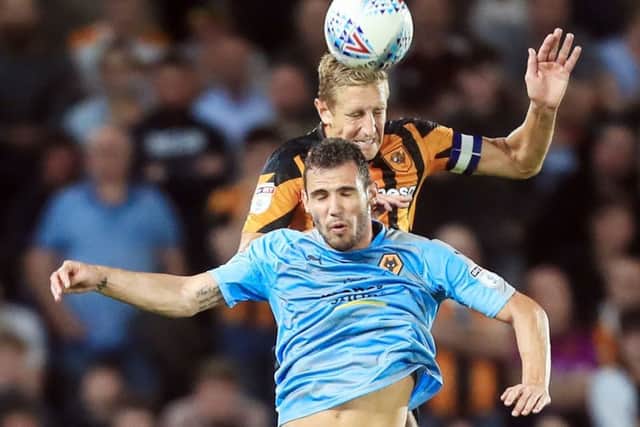 Hull Citys Michael Dawson rises above Wolves Leo Bonatini (Picture:  Danny Lawson/PA Wire).