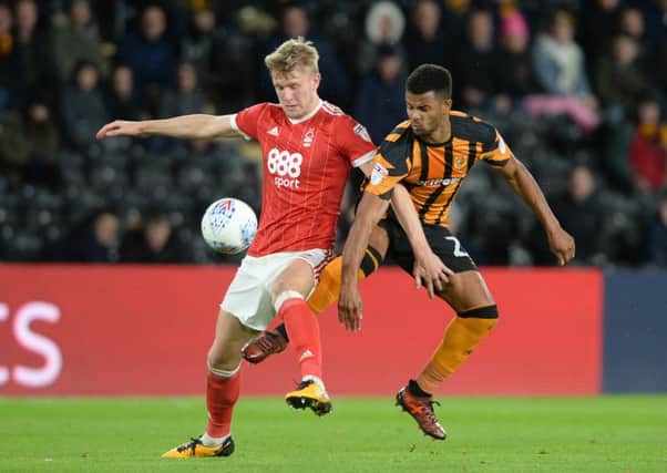 Fraizer Campbell and Joe Worrall challenge for the ball, during Hull City's clash with Nottingham Forest. (Picture: Bruce Rollinson)