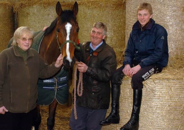 Mary Reverley with her son Keith and grandsom James before the 2009 Grand National when they ran Rambling Minster.