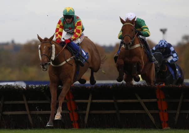 Lil Rockerfeller and jockey Trevor Whelan, left, in action during The Coral Hurdle Race at Ascot last year. Picture: Julian Herbert/PA