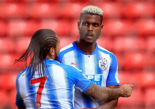 Huddersfield Town's Steve Mounie (right) celebrates scoring his sides first goal with team-mate Sean Scannell during the pre-season friendly match at Oakwell, Barnsley. (Picture: Danny Lawson/PA Wire)