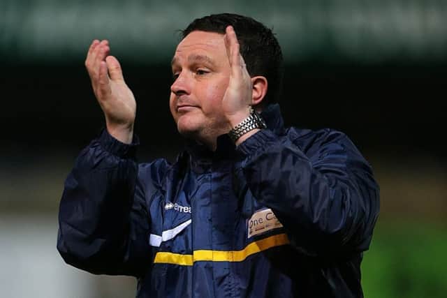Mansfield Town's manager Paul Cox applauds the fans after the FA Cup Third Round match with Liverpool. He is now the manager of Guiseley who welcome Accrington in the FA Cup tomorrow. (Picture: PA)