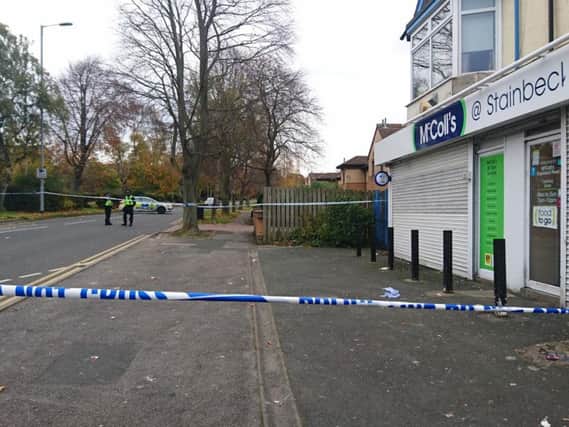 The McColl's shop and police cordon in Stainbeck Road, Meanwood.